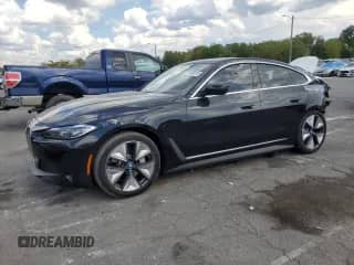 2023 BMW i4 eDrive40 with VIN WBY73AW0XPFP60624, listed as a Copart auction lot 71105675 with 27,584 mi miles and Salvage title. Bid and sale history available at DreamBid. Image 1.