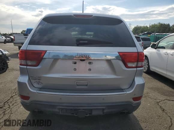 2013 Jeep Grand Cherokee Limited с VIN 1C4RJFBT0DC573354, выставлен на аукционе Copart как лот 64369935 с пробегом 166 333 миль миль и Списание • Salvage title. История ставок и продаж доступна на DreamBid. Изображение 6.