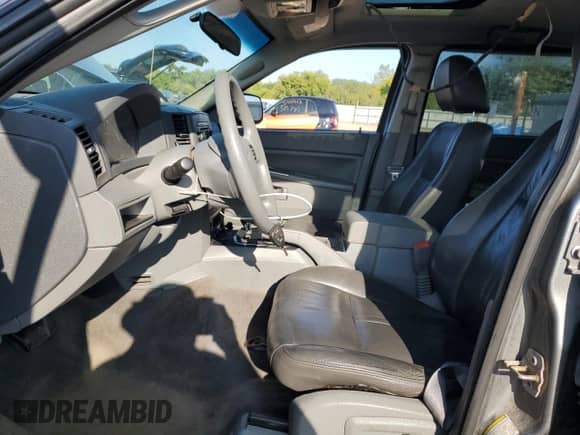 2007 Jeep Grand Cherokee Laredo with VIN 1J8GR48KX7C593322, listed as a Copart auction lot 71458485 with 166,252 mi miles and Salvage title. Bid and sale history available at DreamBid. Image 7.