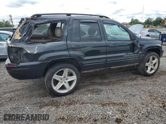 2004 Jeep Grand Cherokee Laredo с VIN 1J4GW48NX4C127597, выставлен на аукционе Copart как лот 69658115 с пробегом Не указан миль и Списание • Salvage title. История ставок и продаж доступна на DreamBid. Изображение 3.