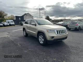 2011 Jeep Grand Cherokee Laredo with VIN 1J4RR4GT2BC557573, listed as a Copart auction lot 86603935 with 148,650 mi miles and Clean title. Bid and sale history available at DreamBid. Image 1.