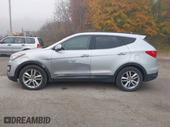 2014 Hyundai Santa Fe with VIN 5XYZWDLA6EG220309, listed as a IAAI auction lot 40650818 with 103,568 mi miles and . Bid and sale history available at DreamBid. Image 14.