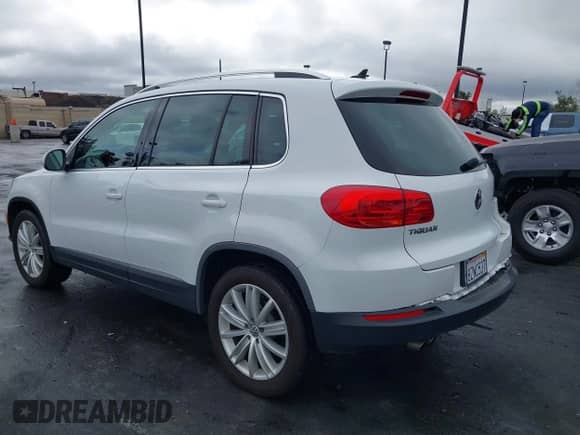 2015 Volkswagen Tiguan S with VIN WVGAV7AX4FW598203, listed as a IAAI auction lot 41902411 with 86,363 mi miles and . Bid and sale history available at DreamBid. Image 3.