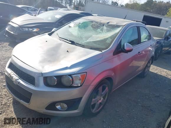 2013 Chevrolet Sonic LTZ with VIN 1G1JE5SG0D4113306, listed as a IAAI auction lot 41897356 with 135,291 mi miles and . Bid and sale history available at DreamBid. Image 2.