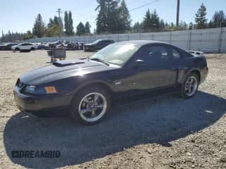2003 Ford Mustang GT Deluxe с VIN 1FAFP42XX3F421786, выставлен на аукционе Copart как лот 80890035 с пробегом 74 089 миль миль и Списание • Salvage title. История ставок и продаж доступна на DreamBid. Изображение 1.