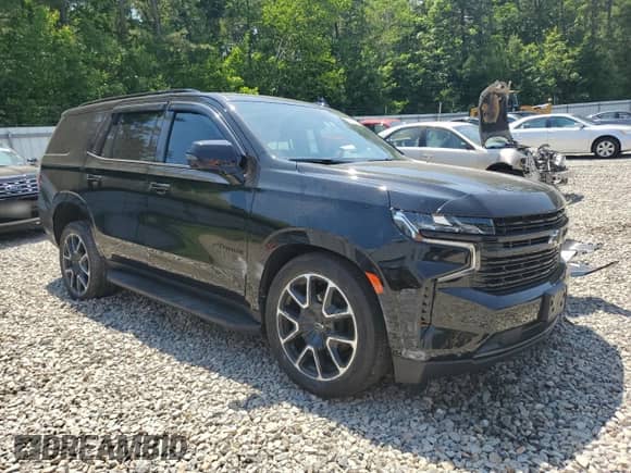 2023 Chevrolet Tahoe RST with VIN 1GNSKRKD1PR329603, listed as a Copart auction lot 62349655 with 32,974 mi miles and Salvage title. Bid and sale history available at DreamBid. Image 4.