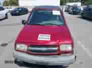 1999 Chevrolet Tracker z VIN 2CNBJ1865X6935435, wystawiony jako IAAI lot #42421108 z przebiegiem Nie podano mil oraz . Historia ofert i sprzedaży dostępna na DreamBid. Obrazek 10.