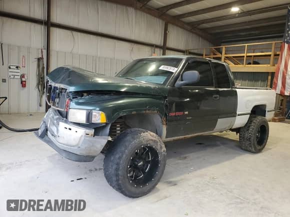 1998 Dodge 1500 with VIN 3B7HF13Y3WG183620, listed as a Copart auction lot 86992874 with 173,441 mi miles and Salvage title. Bid and sale history available at DreamBid. Image 1.