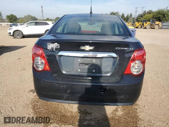 2014 Chevrolet Sonic LT с VIN 1G1JC5SH8E4124828, выставлен на аукционе Copart как лот 80097865 с пробегом 162 418 миль миль и Списание • Salvage title. История ставок и продаж доступна на DreamBid. Изображение 6.