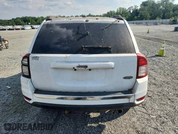 2016 Jeep Compass Latitude with VIN 1C4NJCEA7GD777378, listed as a Copart auction lot 56390385 with 123,186 mi miles and Salvage title. Bid and sale history available at DreamBid. Image 6.