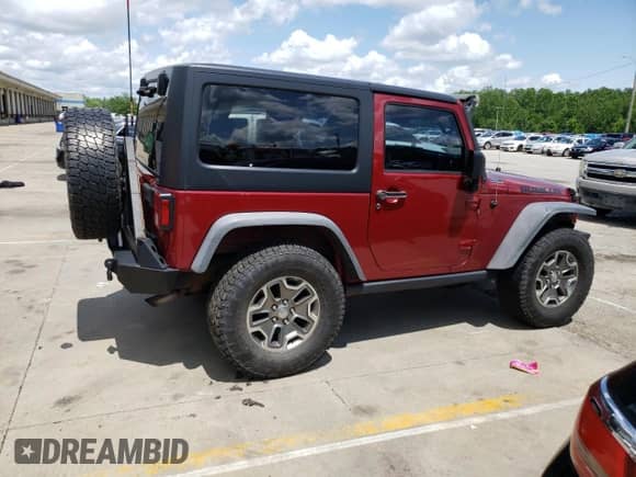 2013 Jeep Wrangler Rubicon 10th Anniversary with VIN 1C4BJWCG6DL508396, listed as a Copart auction lot 61451255 with 125,138 mi miles and Salvage title. Bid and sale history available at DreamBid. Image 3.