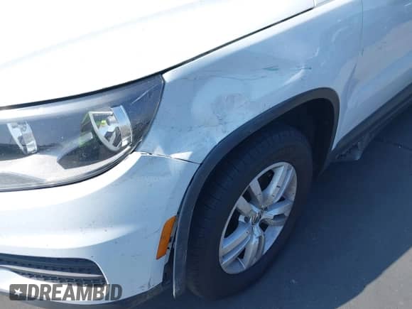 2017 Volkswagen Tiguan S with VIN WVGAV7AX9HK011875, listed as a IAAI auction lot 43359363 with 91,517 mi miles and . Bid and sale history available at DreamBid. Image 12.