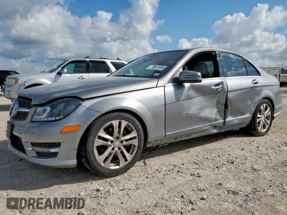 2014 Mercedes-Benz C 250 Sport with VIN WDDGF4HB0EG254273, listed as a Copart auction lot 70661895 with 117,284 mi miles and Salvage title. Bid and sale history available at DreamBid. Image 1.
