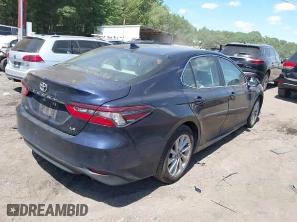 2021 Toyota Camry LE z VIN 4T1C11AK7MU516429, wystawiony jako IAAI lot #42794424 z przebiegiem 52 924 mil mil oraz . Historia ofert i sprzedaży dostępna na DreamBid. Obrazek 4.