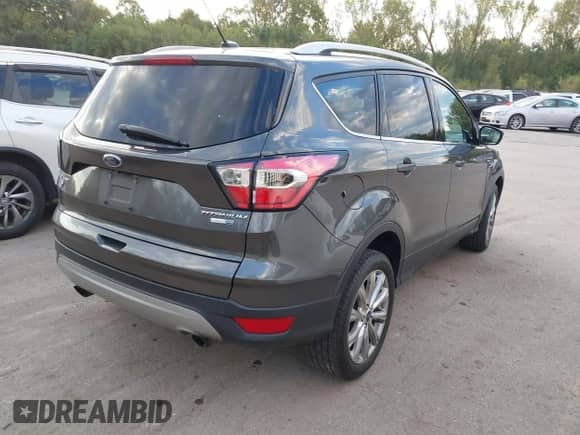 2017 Ford Escape Titanium z VIN 1FMCU9JD1HUD83745, wystawiony jako IAAI lot #43423010 z przebiegiem 257 150 mil mil oraz . Historia ofert i sprzedaży dostępna na DreamBid. Obrazek 4.