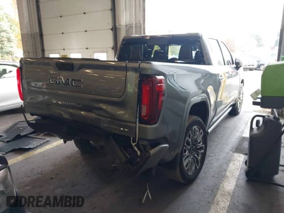 2024 GMC Sierra 1500 Denali Ultimate with VIN 1GTUUHE8XRZ342910, listed as a IAAI auction lot 40813165 with 472 mi miles and . Bid and sale history available at DreamBid. Image 4.