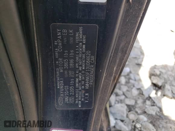 2003 Hyundai Tiburon GT z VIN KMHHN65F13U084620, wystawiony jako Copart lot #46880185 z przebiegiem Nie podano mil oraz Nie do naprawy • Non repairable. Historia ofert i sprzedaży dostępna na DreamBid. Obrazek 12.