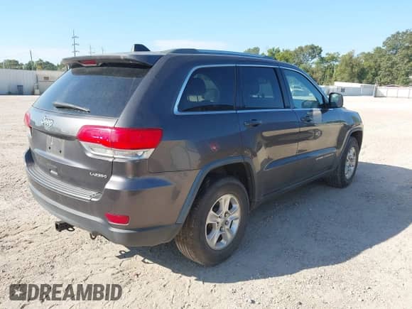 2014 Jeep Grand Cherokee Laredo with VIN 1C4RJEAG8EC141157, listed as a IAAI auction lot 43370151 with 163,137 mi miles and . Bid and sale history available at DreamBid. Image 4.