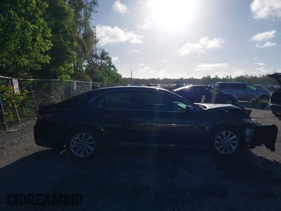 2021 Toyota Camry LE with VIN 4T1C11AK2MU472694, listed as a IAAI auction lot 43340745 with 61,965 mi miles and . Bid and sale history available at DreamBid. Image 13.