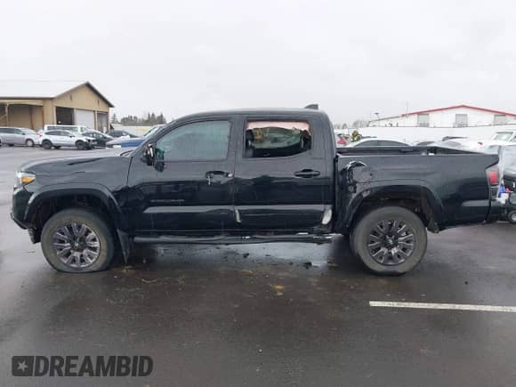 2022 Toyota Tacoma Limited with VIN 3TMGZ5AN4NM463887, listed as a IAAI auction lot 41592060 with 61,026 mi miles and . Bid and sale history available at DreamBid. Image 14.