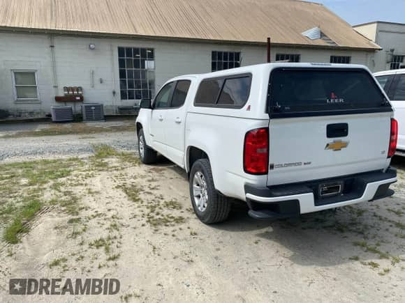 2018 Chevrolet Colorado 2WD LT z VIN 1GCGSCEN1J1165212, wystawiony jako IAAI lot #42221835 z przebiegiem 169 334 mil mil oraz . Historia ofert i sprzedaży dostępna na DreamBid. Obrazek 3.