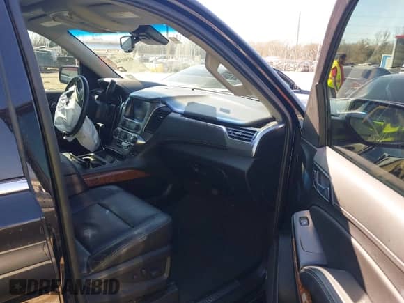 2019 Chevrolet Suburban Premier with VIN 1GNSCJKC5KR360318, listed as a IAAI auction lot 41504344 with 82,997 mi miles and . Bid and sale history available at DreamBid. Image 5.