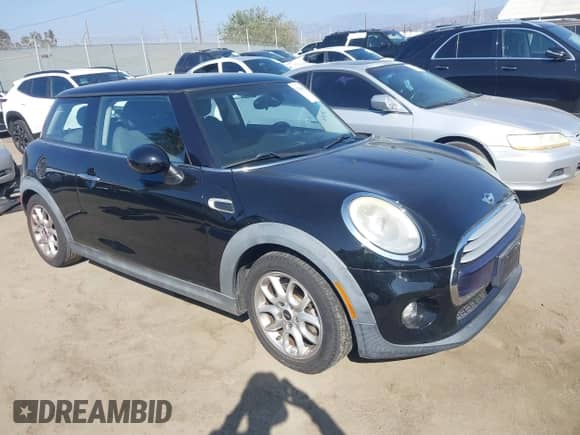 2014 MINI Hardtop with VIN WMWXM5C53ET934731, listed as a IAAI auction lot 43345367 with 48,628 mi miles and . Bid and sale history available at DreamBid. Image 1.
