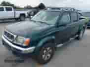 2000 Nissan Frontier XE with VIN 1N6ED27T1YC392998, listed as a IAAI auction lot 43030074 with 195,913 mi miles and . Bid and sale history available at DreamBid. Image 2.