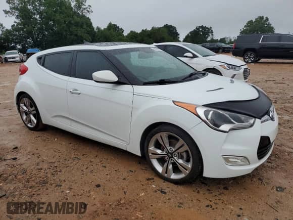 2013 Hyundai Veloster w/Black Int с VIN KMHTC6AD0DU149690, выставлен на аукционе Copart как лот 68201775 с пробегом 112 030 миль миль и Списание • Salvage title. История ставок и продаж доступна на DreamBid. Изображение 4.