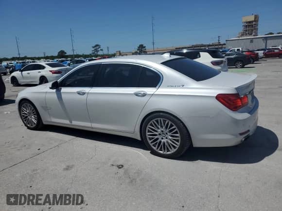 2011 BMW 7 Series with VIN WBAKX8C59BC198179, listed as a Copart auction lot 52796825 with 123,725 mi miles and Salvage title. Bid and sale history available at DreamBid. Image 2.