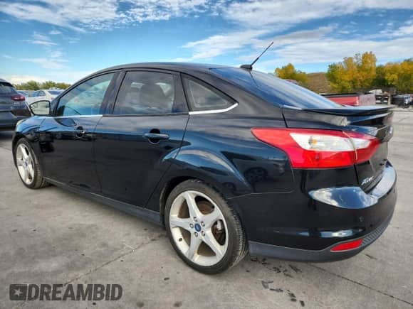 2014 Ford Focus Titanium with VIN 1FADP3J28EL224272, listed as a Copart auction lot 86531015 with 192,653 mi miles and Clean title. Bid and sale history available at DreamBid. Image 2.