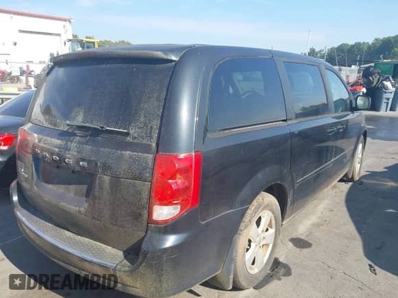 2013 Dodge Grand Caravan American Value with VIN 2C4RDGBG1DR601010, listed as a IAAI auction lot 43293889 with 156,529 mi miles and . Bid and sale history available at DreamBid. Image 4.