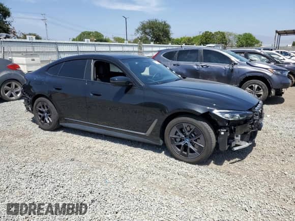 2022 BMW i4 eDrive40 with VIN WBY73AW05NFN10284, listed as a Copart auction lot 57851335 with 22,431 mi miles and Salvage title. Bid and sale history available at DreamBid. Image 4.