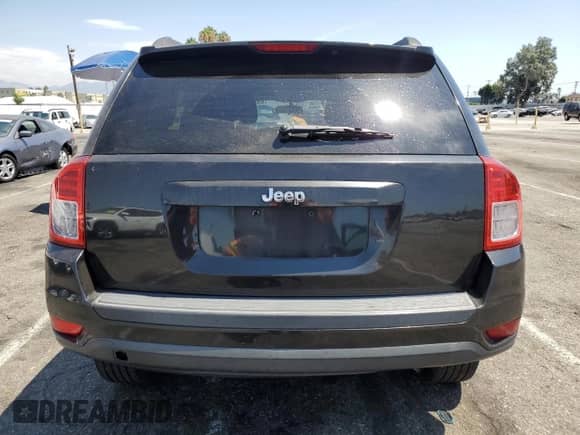 2011 Jeep Compass with VIN 1J4NT1FA0BD137755, listed as a Copart auction lot 69515235 with 108,023 mi miles and Salvage title. Bid and sale history available at DreamBid. Image 6.