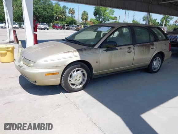 1997 Saturn SW with VIN 1G8ZK8277VZ368280, listed as a IAAI auction lot 42269973 with 159,404 mi miles and . Bid and sale history available at DreamBid. Image 2.