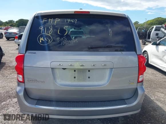 2019 Dodge Grand Caravan SXT with VIN 2C4RDGCG7KR761789, listed as a IAAI auction lot 43333914 with 144,794 mi miles and . Bid and sale history available at DreamBid. Image 16.