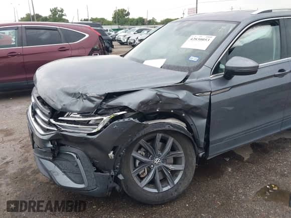 2023 Volkswagen Tiguan SE with VIN 3VV3B7AX4PM095392, listed as a IAAI auction lot 42830053 with 14,674 mi miles and . Bid and sale history available at DreamBid. Image 6.