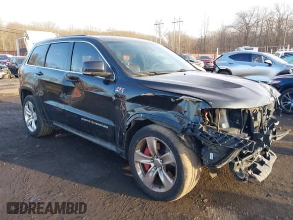 2015 Jeep Grand Cherokee SRT with VIN 1C4RJFDJ6FC744087, listed as a IAAI auction lot 41500653 with 130,530 mi miles and . Bid and sale history available at DreamBid. Image 18.