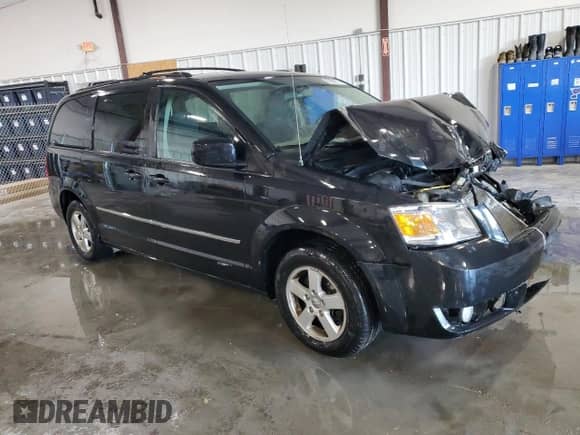 2010 Dodge Grand Caravan SXT z VIN 2D4RN5D17AR409597, wystawiony jako Copart lot #83994974 z przebiegiem Nie podano mil oraz Szkoda całkowita • Salvage title. Historia ofert i sprzedaży dostępna na DreamBid. Obrazek 4.