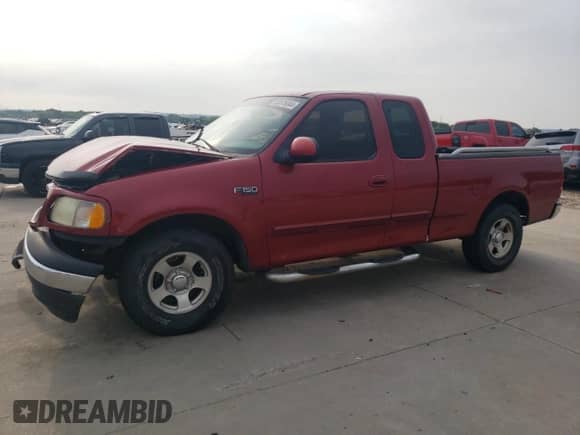 2001 Ford F-150 with VIN 2FTZX17281CA44273, listed as a Copart auction lot 63678044 with 175,404 mi miles and Salvage title. Bid and sale history available at DreamBid. Image 1.