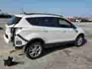 2018 Ford Escape SE with VIN 1FMCU9GDXJUB59001, listed as a Copart auction lot 84057235 with 60,517 mi miles and Salvage title. Bid and sale history available at DreamBid. Image 3.
