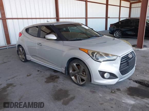 2014 Hyundai Veloster Turbo with VIN KMHTC6AE1EU182840, listed as a IAAI auction lot 43023906 with 56,788 mi miles and . Bid and sale history available at DreamBid. Image 1.