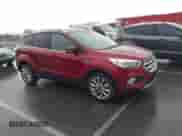 2017 Ford Escape Titanium z VIN 1FMCU9J97HUA95899, wystawiony jako IAAI lot #43365600 z przebiegiem 95 376 mil mil oraz . Historia ofert i sprzedaży dostępna na DreamBid. Obrazek 1.