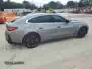 2023 BMW i4 eDrive35 with VIN WBY43AW0XPFP98552, listed as a Copart auction lot 63310845 with 13,769 mi miles and Salvage title. Bid and sale history available at DreamBid. Image 3.