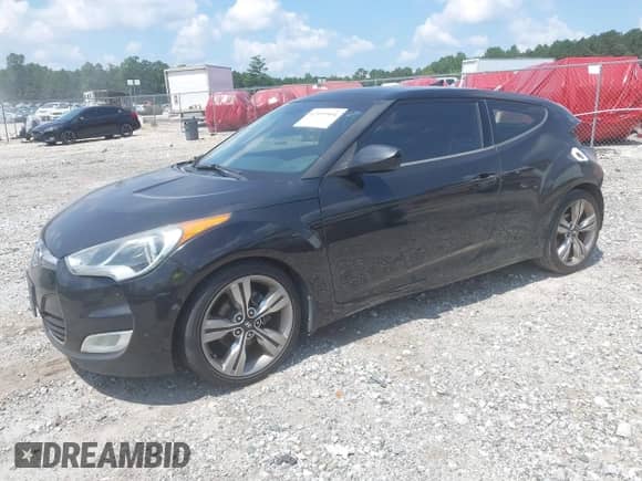 2012 Hyundai Veloster w/Red Int with VIN KMHTC6AD7CU067048, listed as a IAAI auction lot 42999504 with 188,136 mi miles and . Bid and sale history available at DreamBid. Image 2.