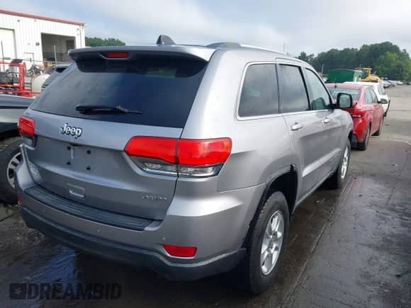 2016 Jeep Grand Cherokee Laredo with VIN 1C4RJFAG5GC444471, listed as a IAAI auction lot 43011713 with 169,413 mi miles and . Bid and sale history available at DreamBid. Image 4.