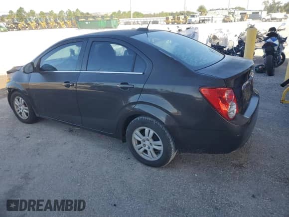 2015 Chevrolet Sonic LT with VIN 1G1JC5SH2F4210833, listed as a Copart auction lot 84629735 with 119,786 mi miles and Salvage title. Bid and sale history available at DreamBid. Image 2.