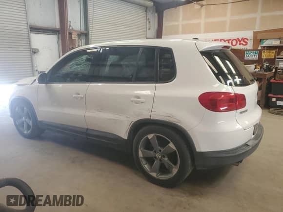 2013 Volkswagen Tiguan z VIN WVGCV3AXXDW570761, wystawiony jako Copart lot #51603655 z przebiegiem 119 932 mil mil oraz Czysty tytuł • Clean title. Historia ofert i sprzedaży dostępna na DreamBid. Obrazek 2.