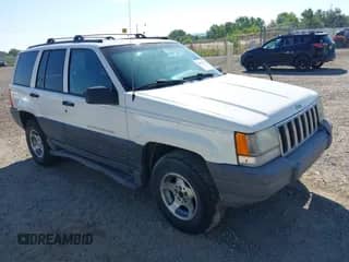 1998 Jeep Grand Cherokee Laredo z VIN 1J4GZ58Y1WC174060, wystawiony jako IAAI lot #42907083 z przebiegiem 238 848 mil mil oraz . Historia ofert i sprzedaży dostępna na DreamBid. Obrazek 1.