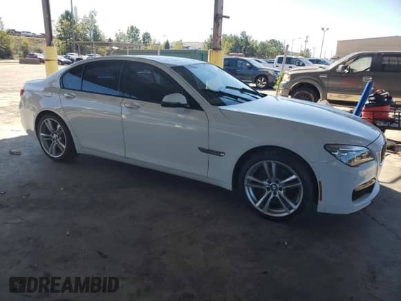 2014 BMW 7 Series 740i с VIN WBAYA6C59ED144122, выставлен на аукционе Copart как лот 75059334 с пробегом 78 090 миль миль и Списание • Salvage title. История ставок и продаж доступна на DreamBid. Изображение 4.